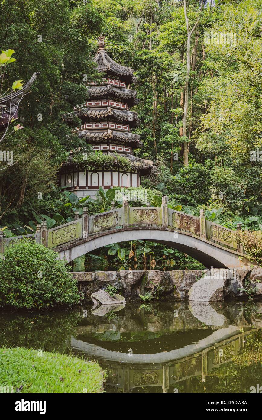 Shenzhen, China. October, 2019. The pagoda and stone bridge in Shenzhen International Garden and Flower Expo Park. The park serves multiple functions, Stock Photo
