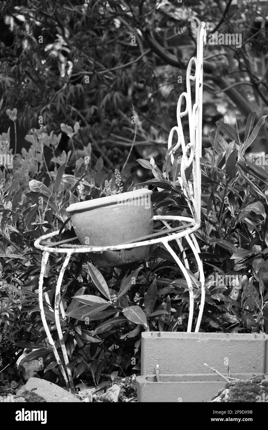 black and white picture of an old metal chair that was converted into a