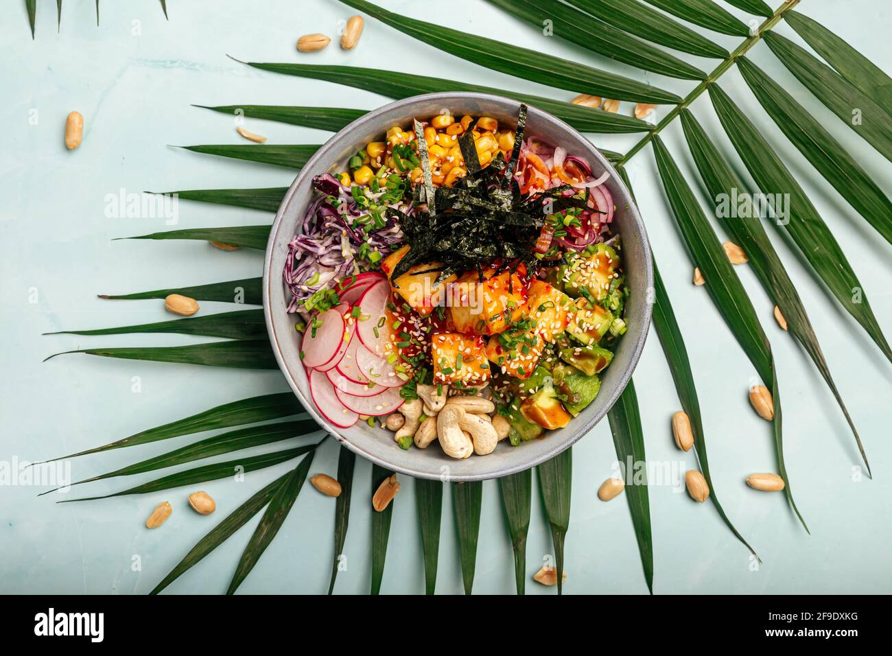 Vegetarian tofu poke bowl with rice and vegetables Stock Photo - Alamy