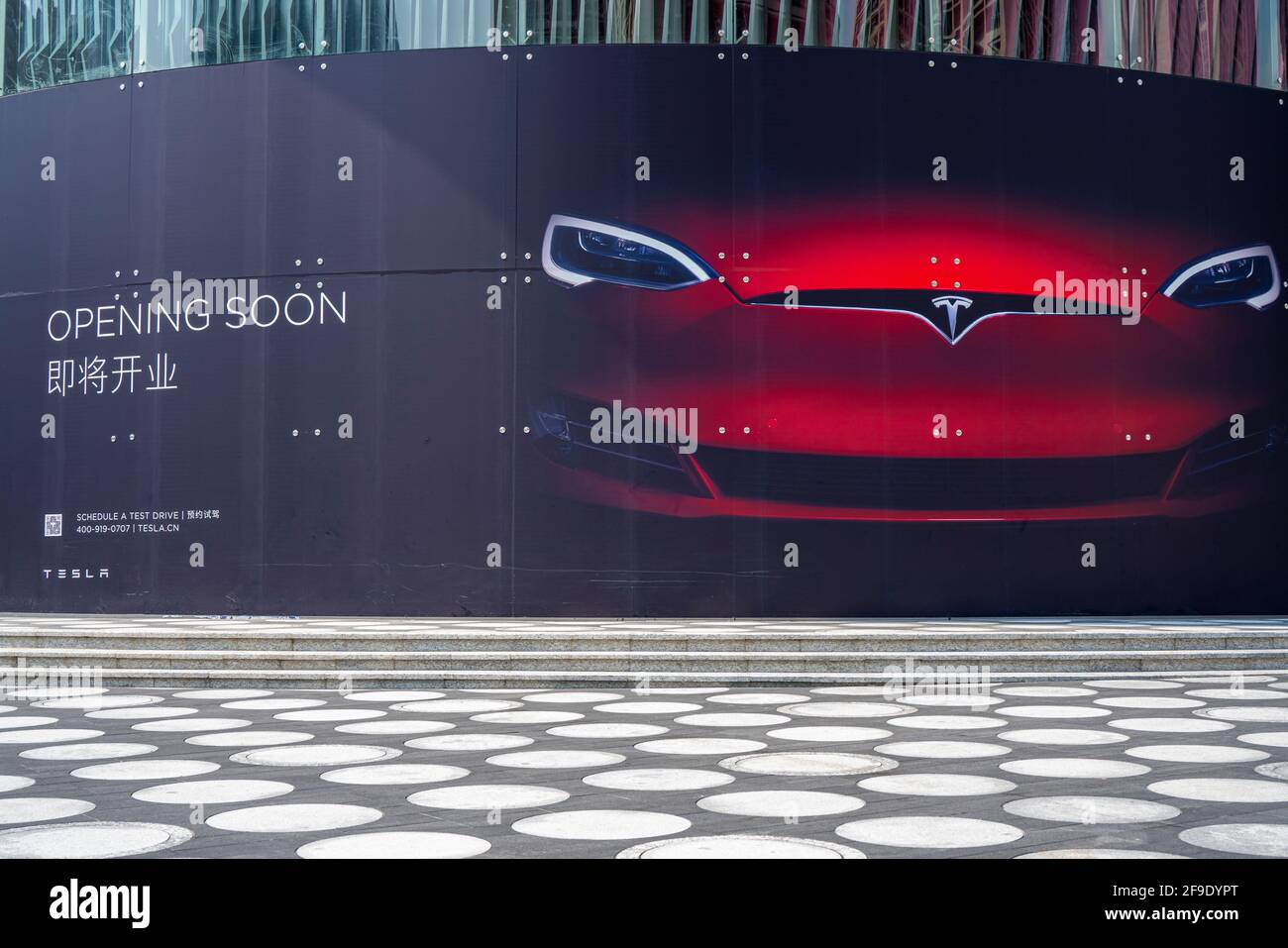 Shenzhen, China. October, 2019. Tesla is coming soon at ONE AVENUE. Tesla specializes in electric car manufacturing and, through its SolarCity subsidi Stock Photo