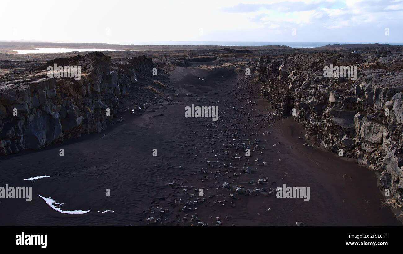 Big rock fissure above the Mid Atlantic Ridge (MAR), where Eurasian and American tectonic plates drift apart, near the Bridge Between Continents. Stock Photo