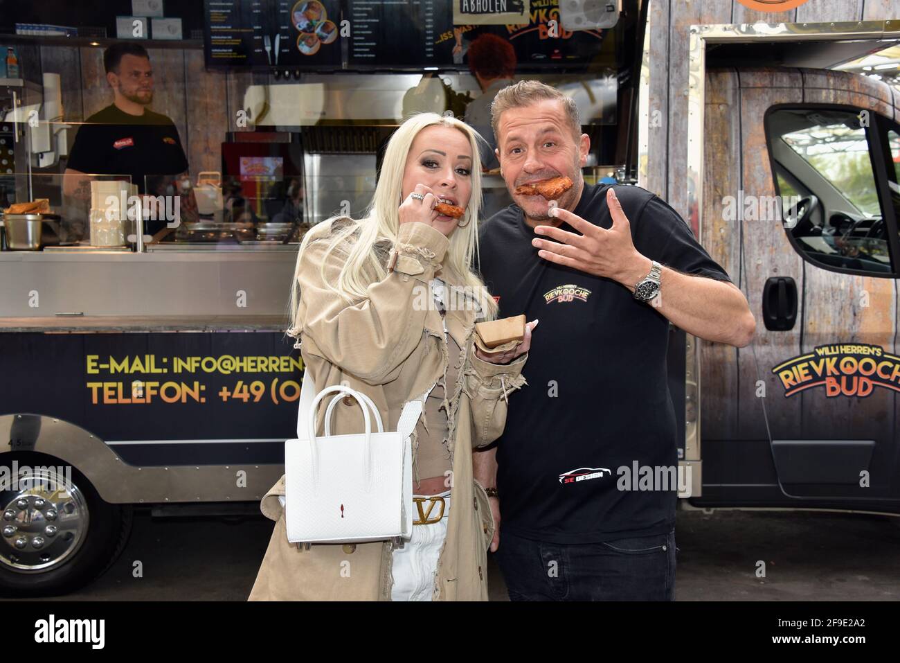 Frechen, Germany. 16th Apr, 2021. Willi Herren and Cora Schumacher at the opening of 'Willi Herrens Rievkooche Bud', a food truck on the Selgros premises. Credit: Horst Galuschka/dpa/Alamy Live News Stock Photo