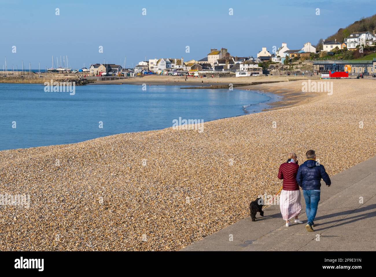 Lyme Regis, Dorset, UK. 18th Apr, 2021. UK Weather. A lovely warm and sunny start to the day at the seaside resort of Lyme Regis. Locals enjoy the quiet on Sunday morning before the beach gets busy. Credit: Celia McMahon/Alamy Live News Stock Photo