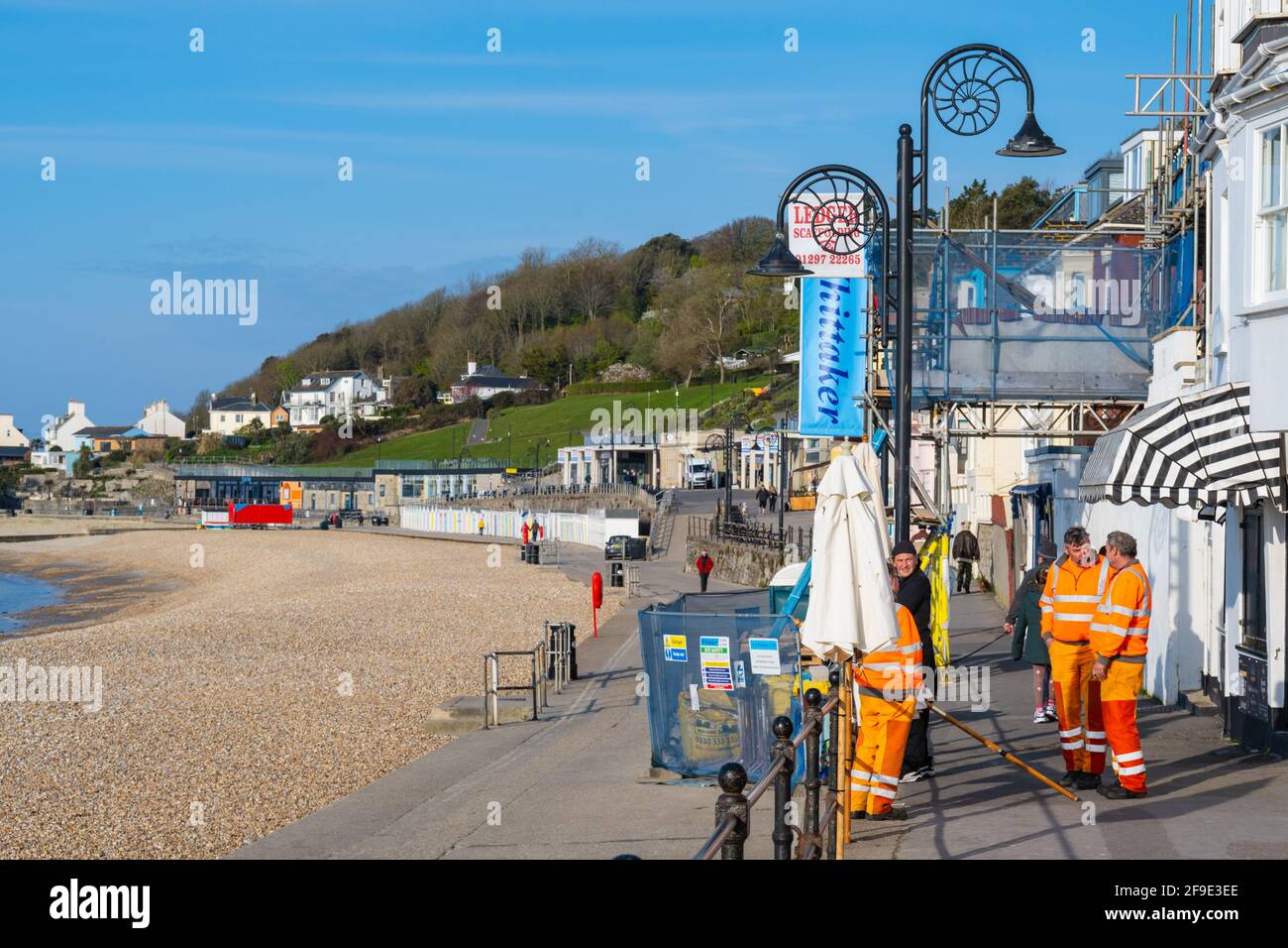 Lyme Regis, Dorset, UK. 18th Apr, 2021. UK Weather. A lovely warm and sunny start to the day at the seaside resort of Lyme Regis. Council workers prepare for a busy day ahead of the crowds. Credit: Celia McMahon/Alamy Live News Stock Photo