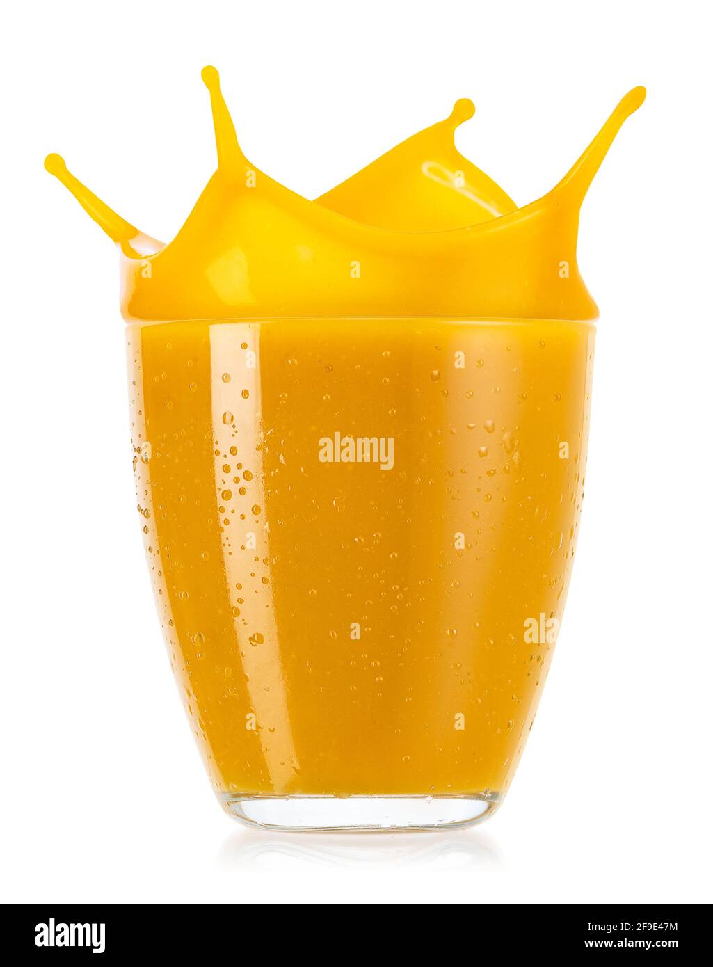 glass of splashing mango smoothies isolated on white Stock Photo