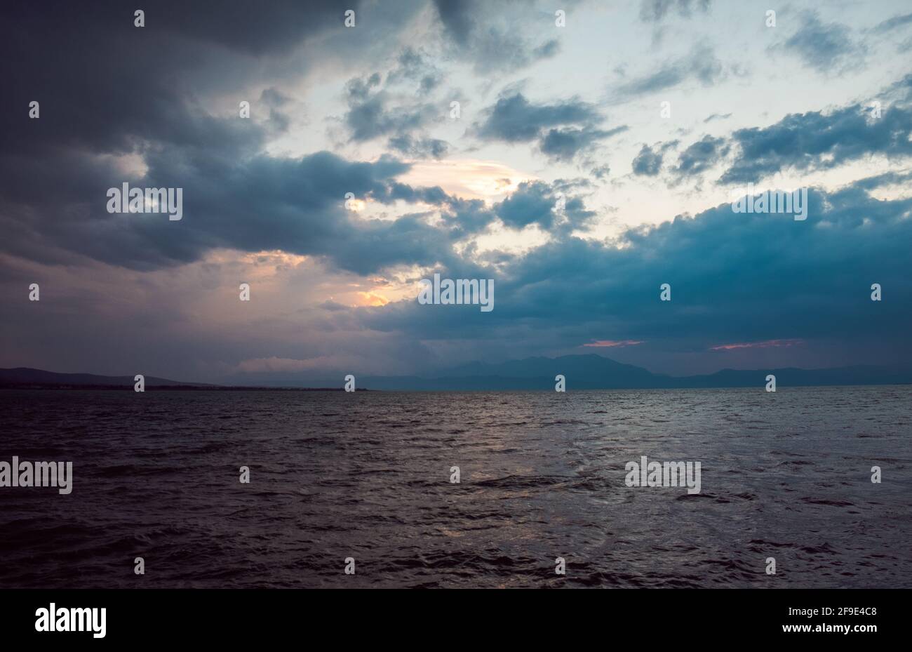 A dramatic sky over a raging sea Stock Photo - Alamy