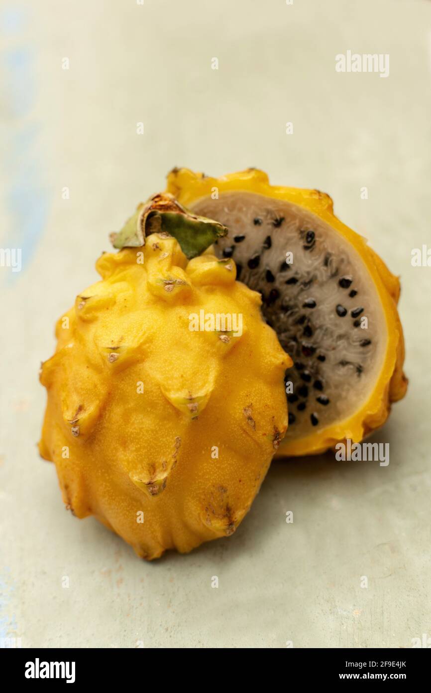 Pitaya Yellow Ripe A yellow Pitaya on a wooden table, France Stock Photo - Alamy