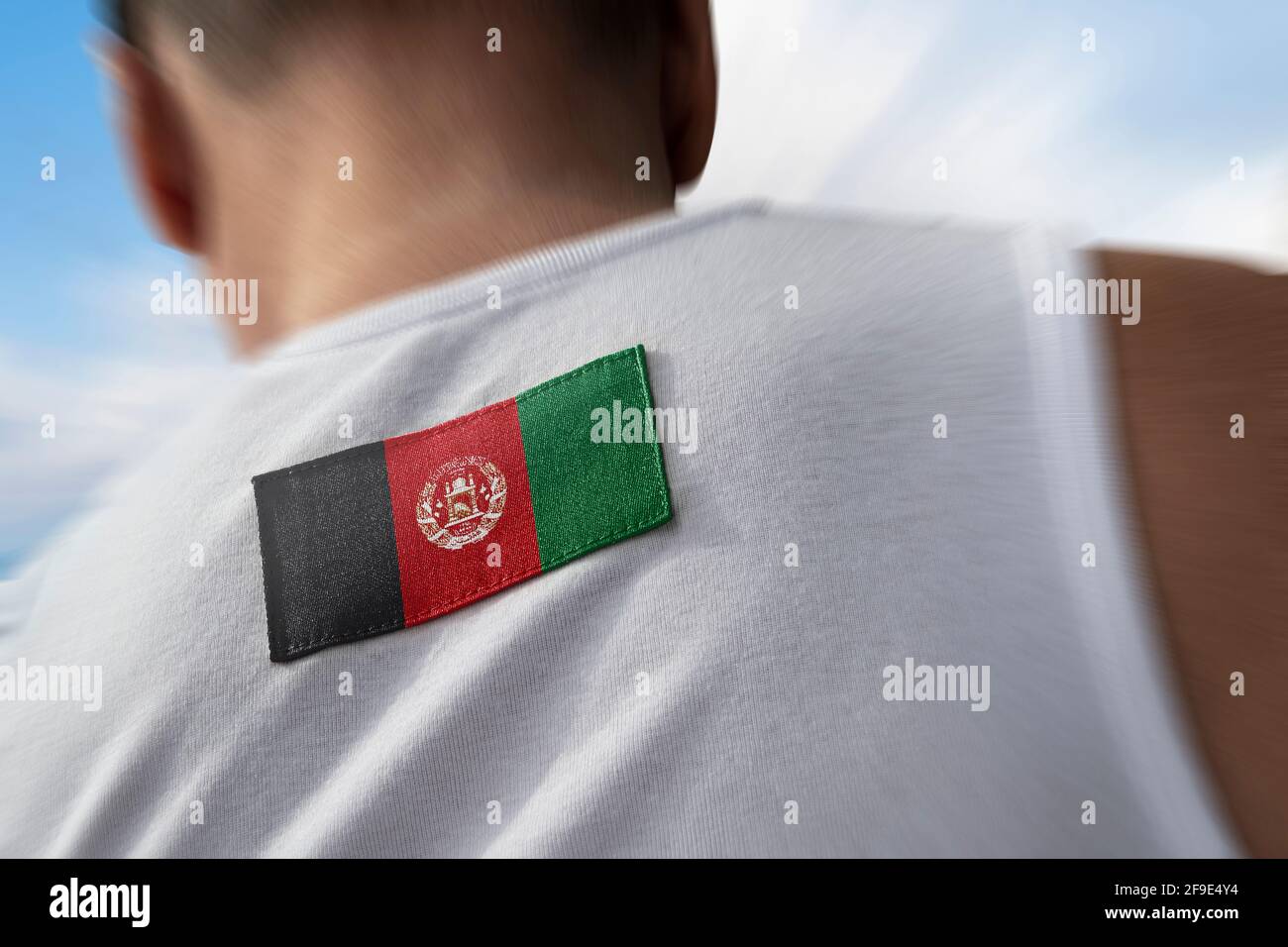 The national flag of Afghanistan on the athlete's back Stock Photo