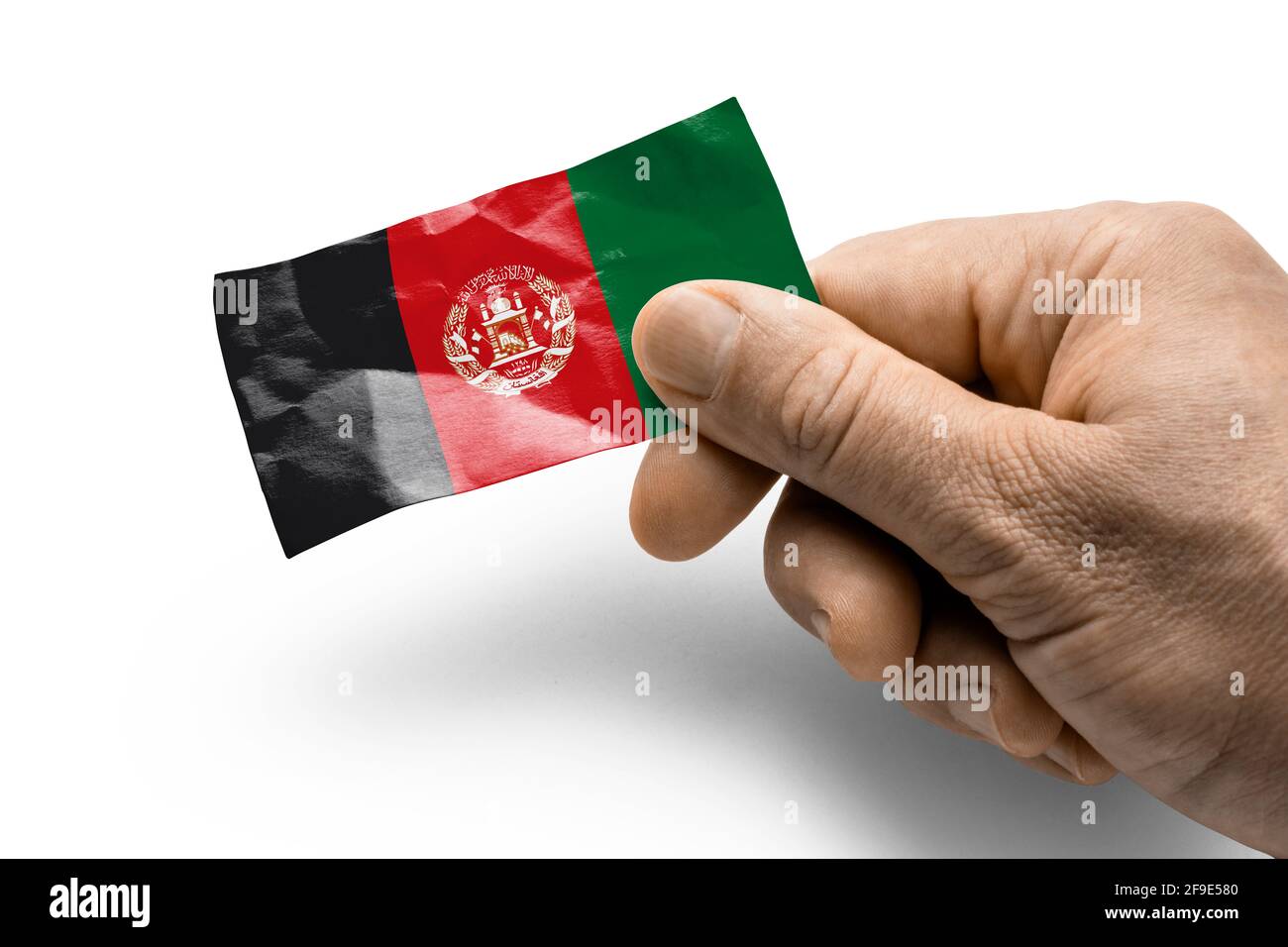 Hand holding a card with a national flag the Afghanistan Stock Photo