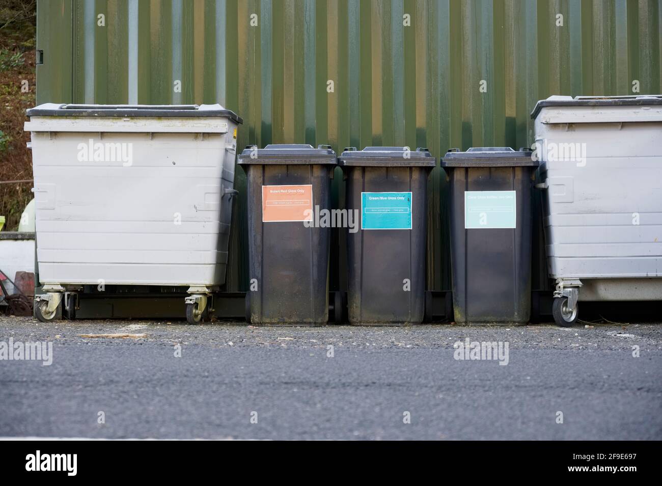 Black recycle wheelie bins in row for collection Stock Photo Alamy