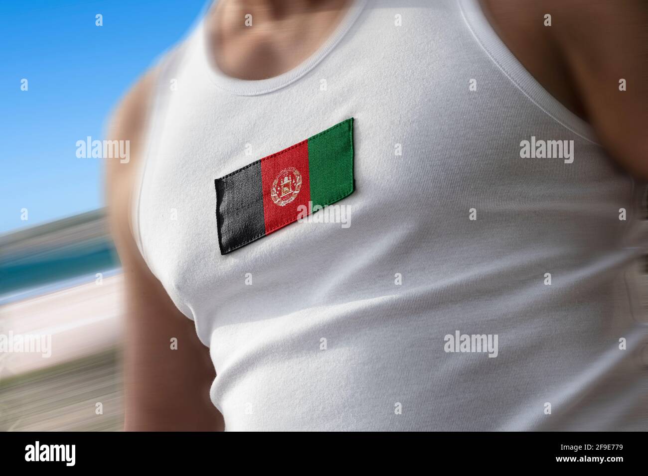 The national flag of Afghanistan on the athlete's chest Stock Photo