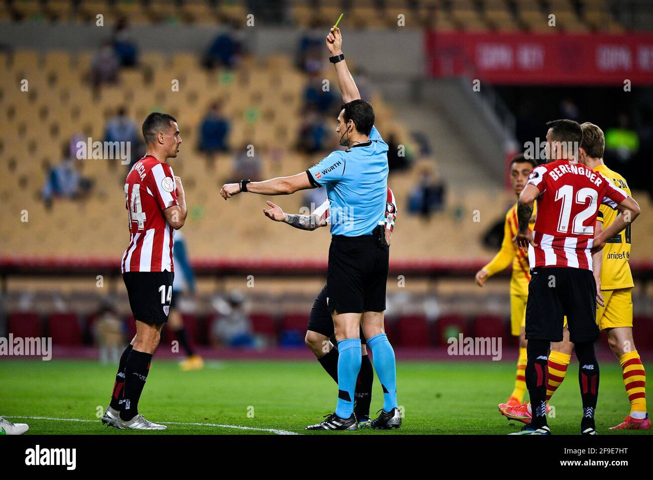 SEVILLE, SPAIN - APRIL 17: Dani Garcia of Athletic Bilbao and referee Juan Martinez Munuera during the Copa del Rey Final match between Athletic Club Stock Photo