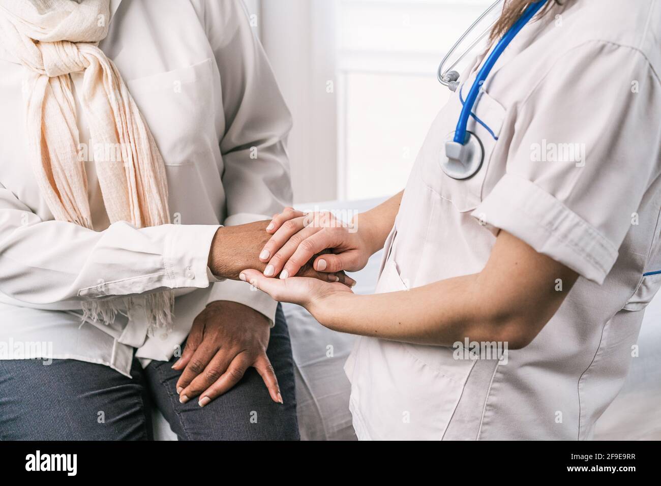 Cropped unrecognizable female doctor in medical uniform and stethoscope ...