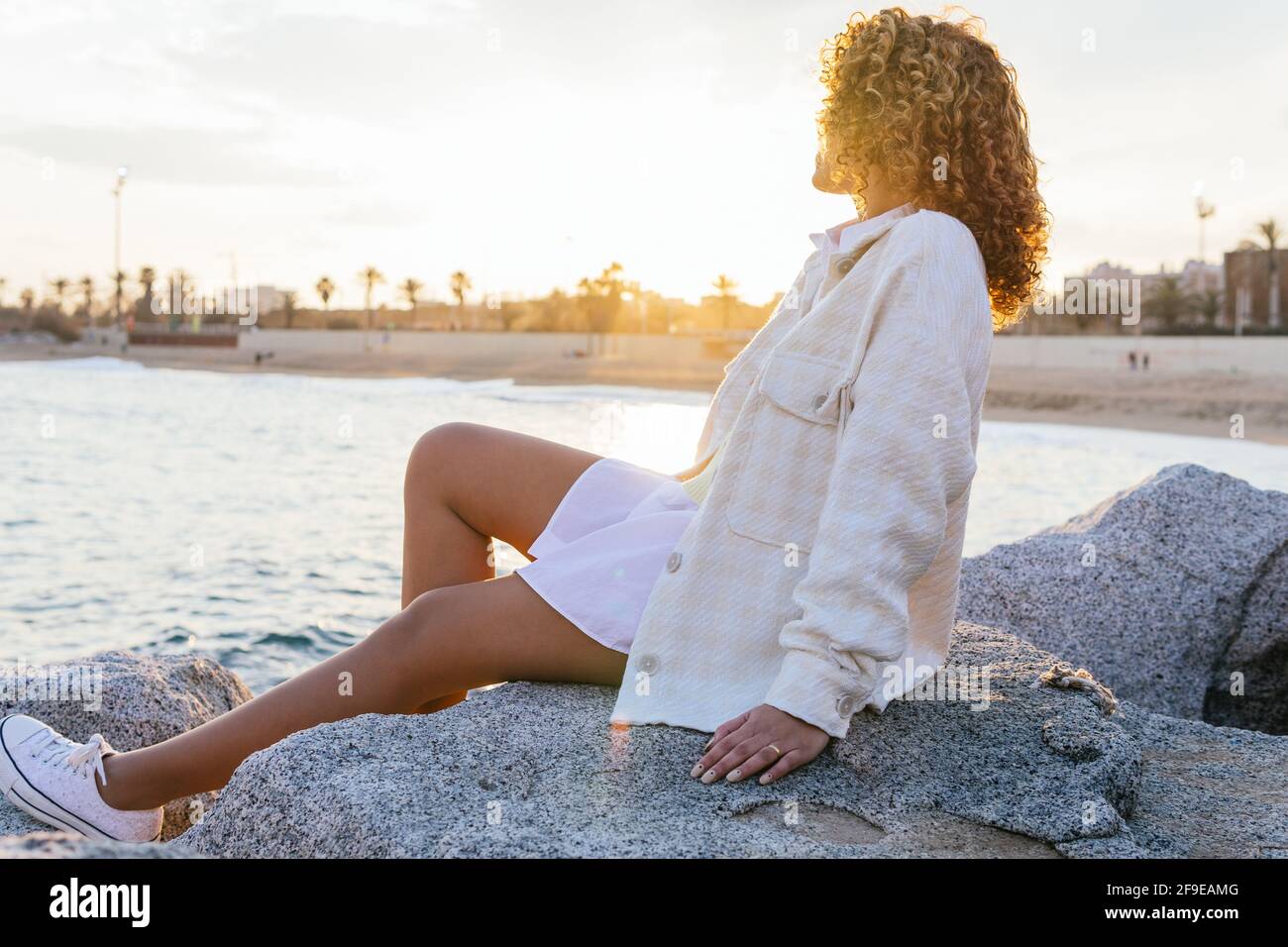 Anonymous woman admiring sea rock hi-res stock photography and images ...