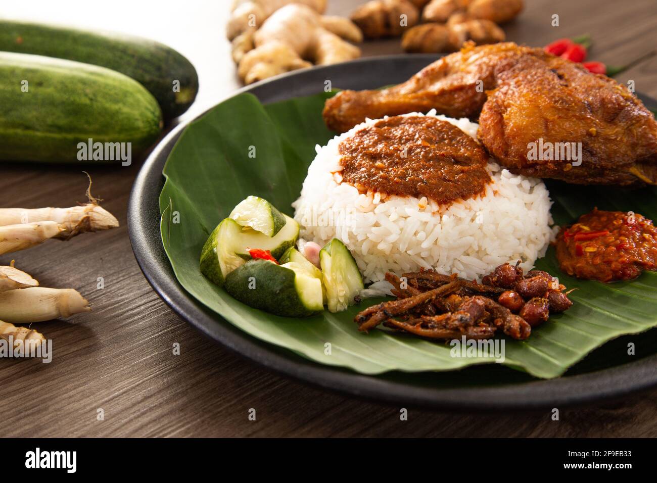 Nasi Kukus Is Usually Comprising Freshly Steamed Rice Crispy Fried Chicken Sambal Belacan Acar And A Curry Gravy Stock Photo Alamy