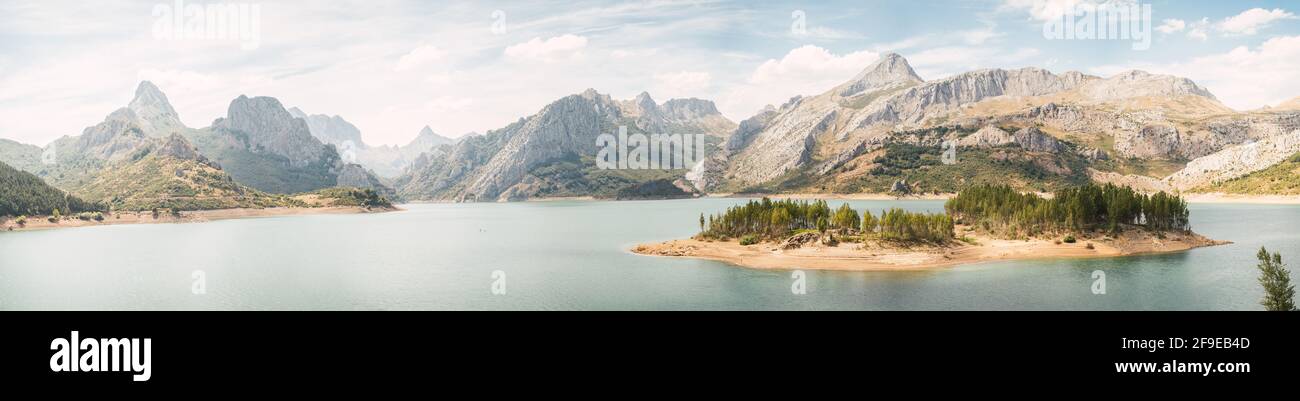Nice landscape of a huge river surrounded by mountains on a cloudy day ...