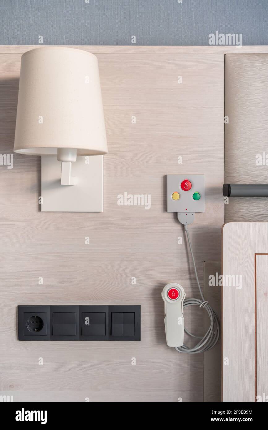 Nurse call system with emergency buttons installed near bed in medical