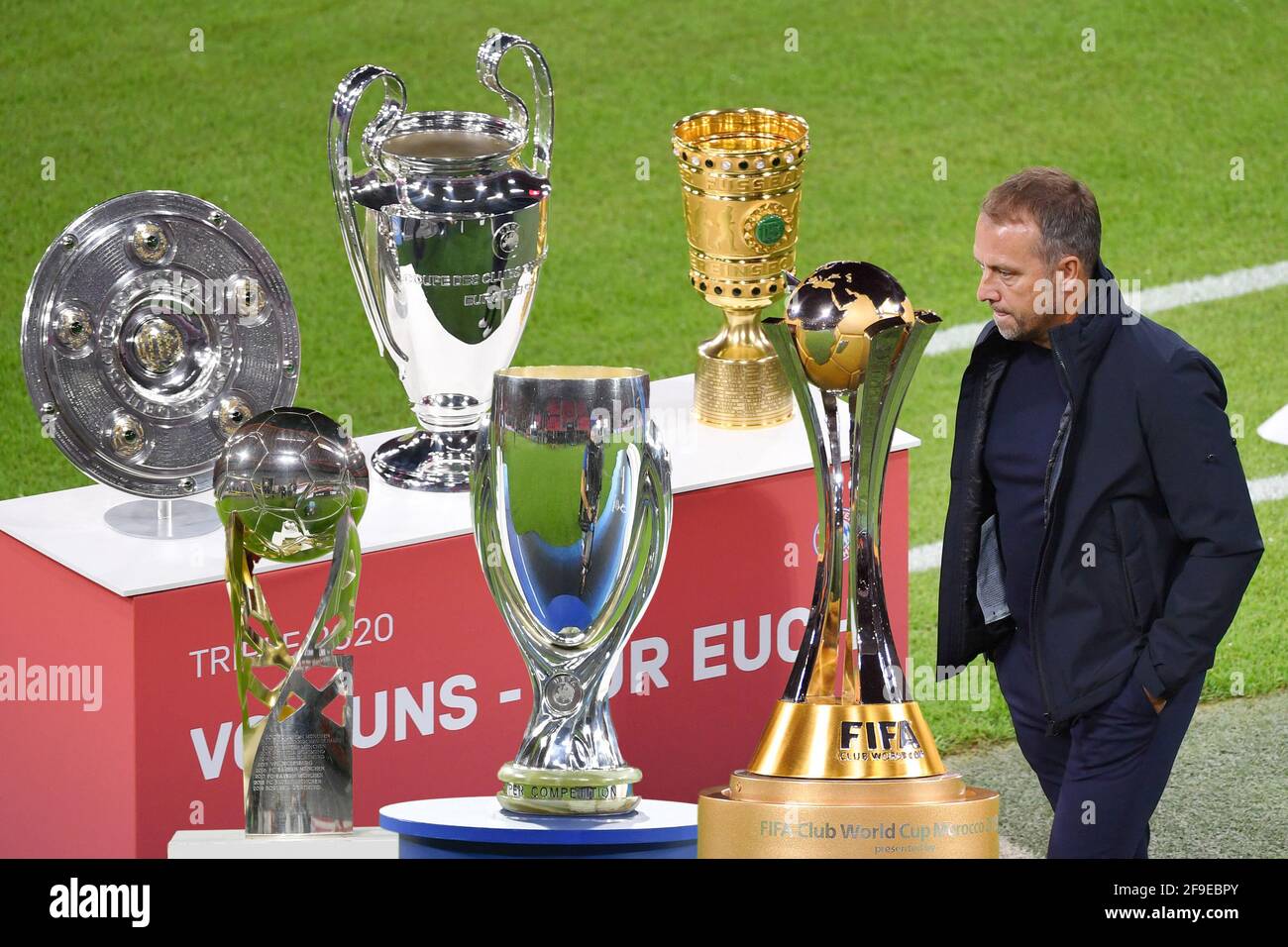 PHOTOMONTAGE: At the end of the era of Hansi Flick as coach of FC Bayern  Munich. Archive photo: The triple bowl, championship trophy, Champions  League cup and DFB cup are presented -