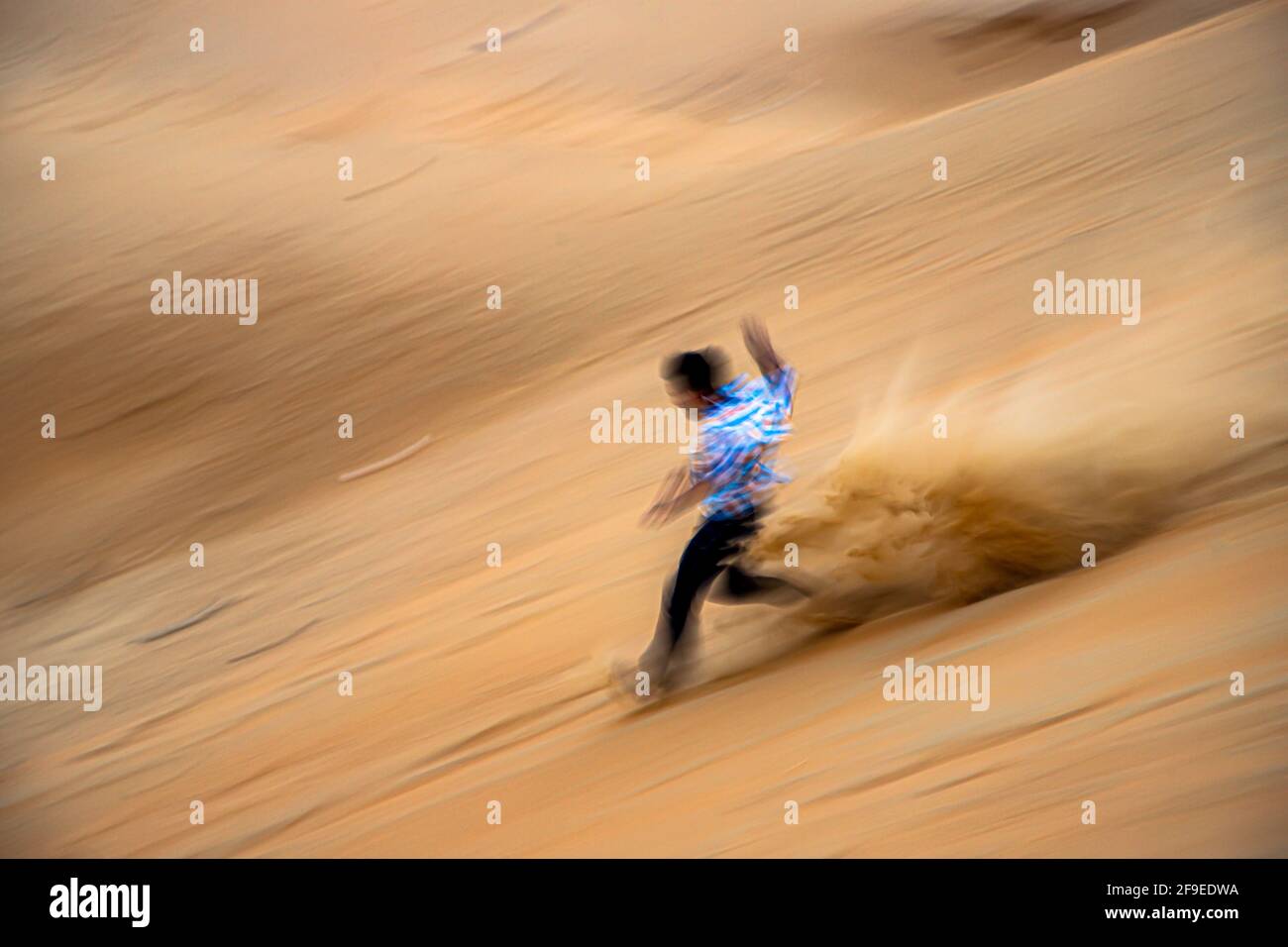slow shutter speed,motion blur.a man running in desert Stock Photo Alamy