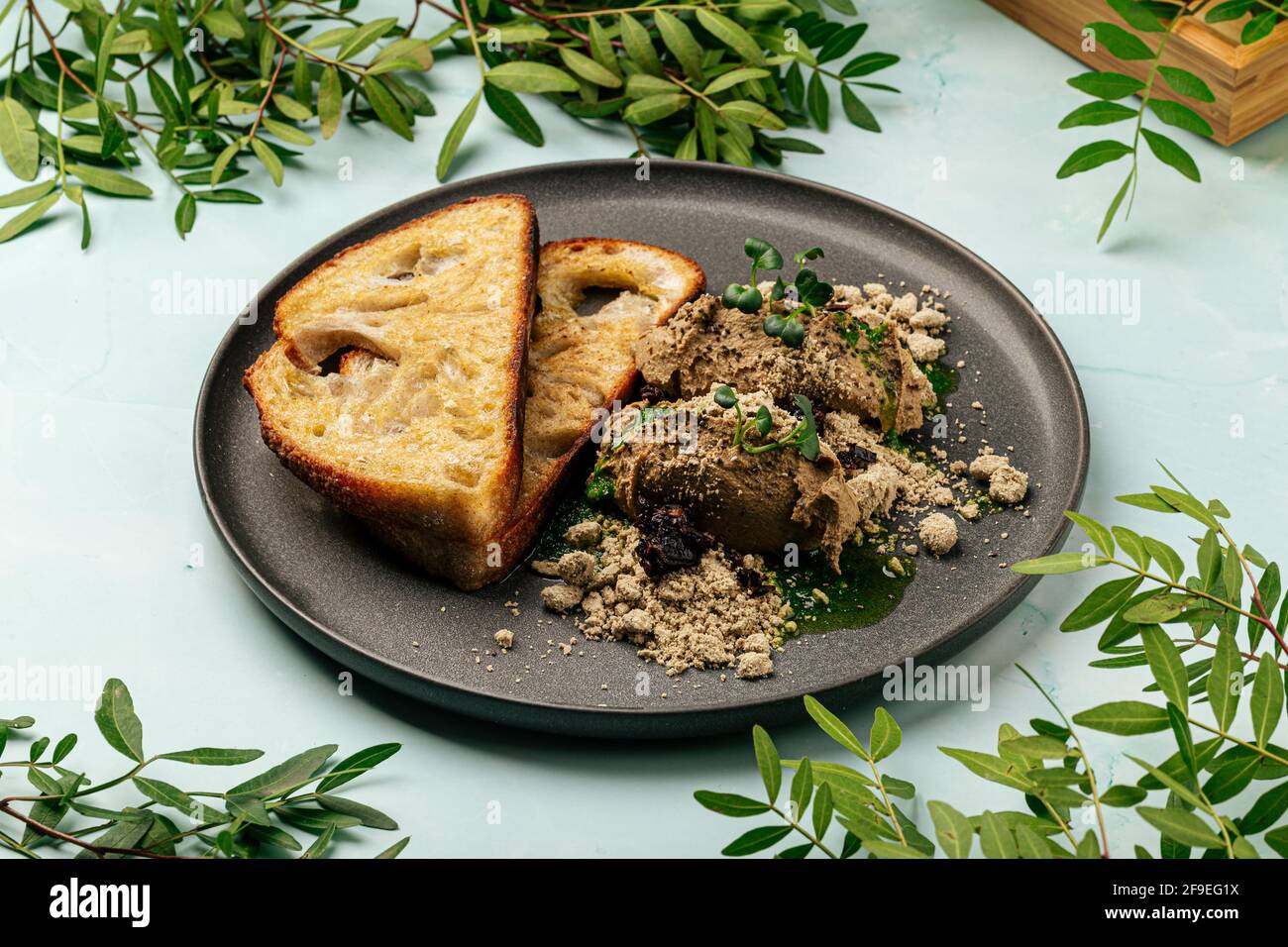 Toasts chicken liver pate with halva and prunes Stock Photo Alamy