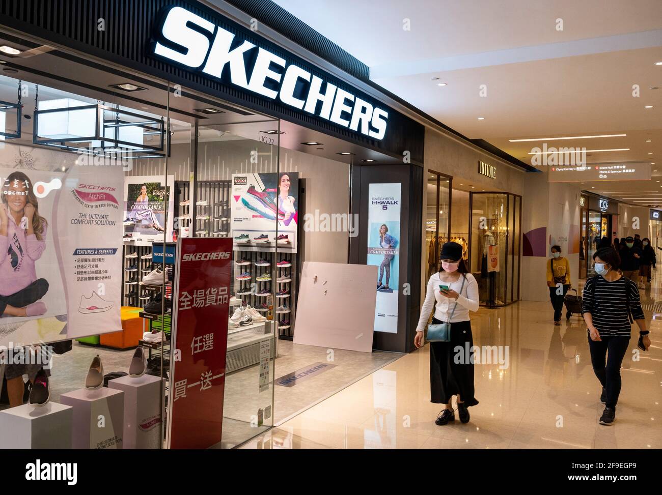 Shoppers walk past the American lifestyle and performance footwear brand,  Skechers store in Hong Kong. (Photo by Budrul Chukrut / SOPA Images/Sipa  USA Stock Photo - Alamy
