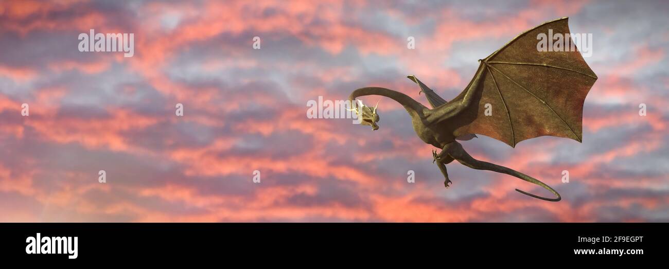 dragon, magical creature flying in front of the sunrise Stock Photo