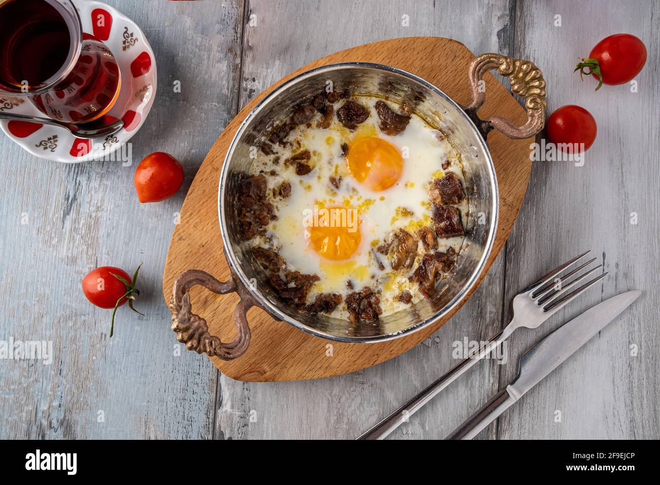 Turkish scrambled eggs with roasted meat in copper pan Stock Photo Alamy