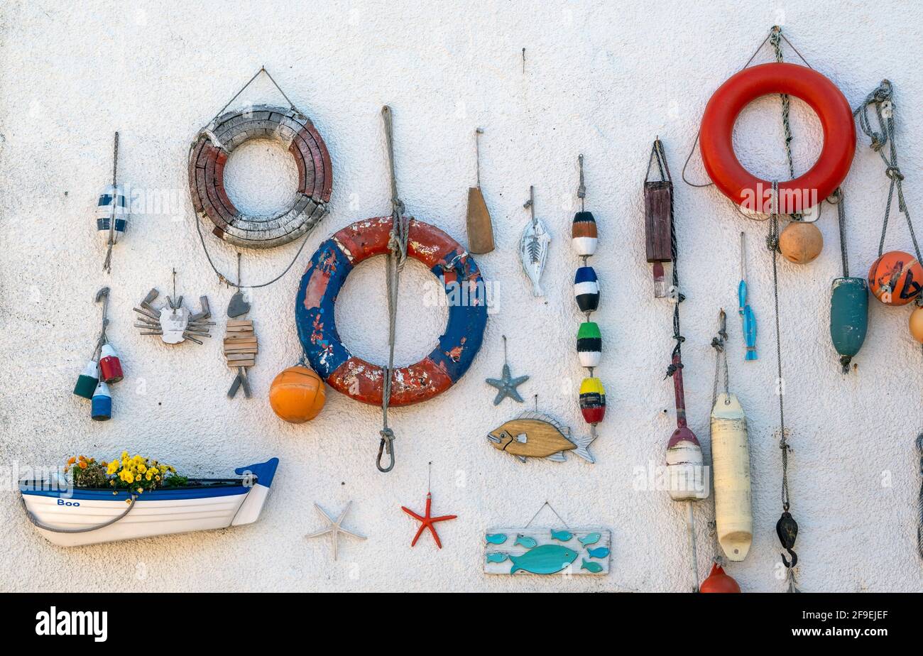 The wall of a house in Lower Largo, Fife decorated with a fishing theme. Stock Photo