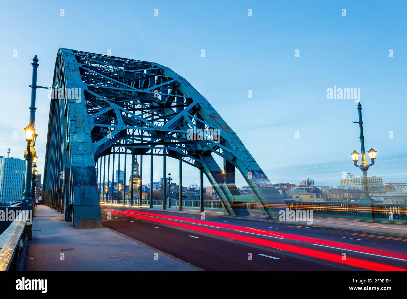 Newcastle upon Tyne UK: 16th March 2021: Tyne Bridge long exposure with blurred traffic during rush hour and blue hour. Colourful and bright Stock Photo