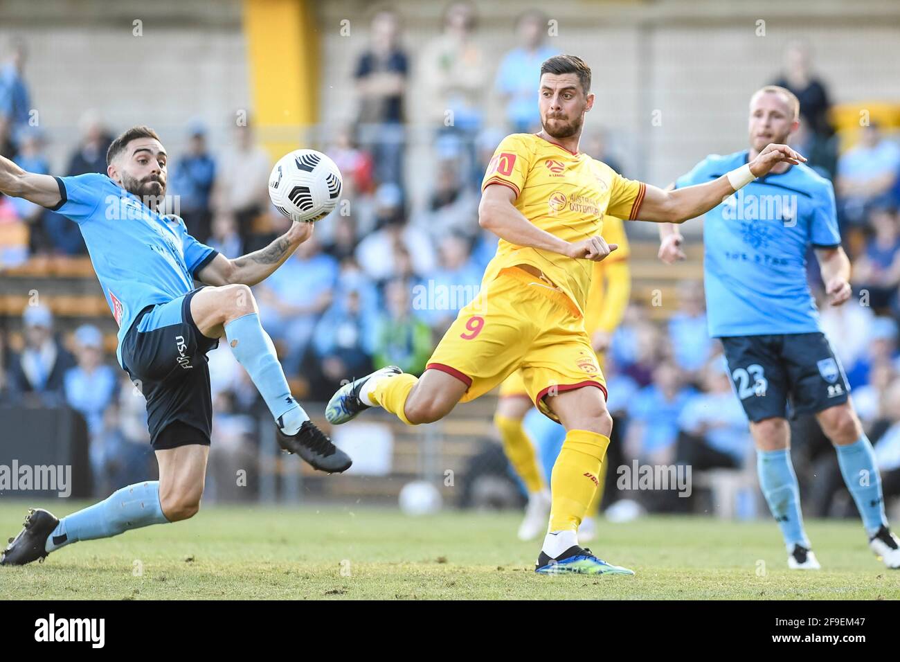 18th April 2021; Leichardt Oval, Sydney, New South Wales, Australia; A League Football, Sydney Football Club versus Adelaide United; Tomi Juric of Adelaide United waits for the ball to drop and shoot as Anthony Caceres of Sydney intercepts Stock Photo