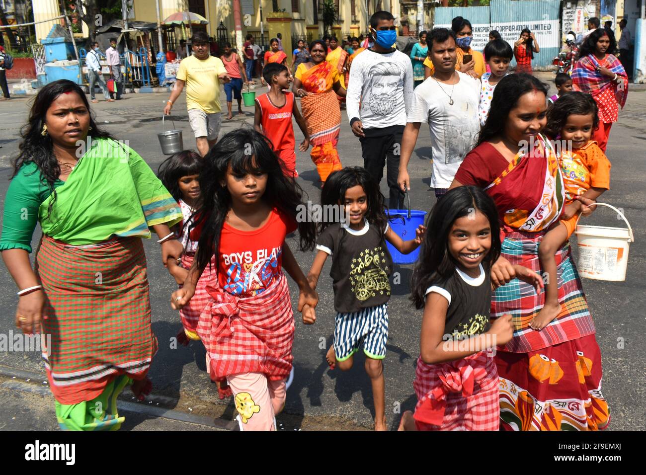 Kolkata, India. 18th Apr, 2021. Devotees are going towards Adi Ganga without wearing protective mask to take a bath before performing a ritual on the occasion of Shitala Puja amid the spread of Covid-19 in Kolkata. (Photo by Sudipta Das/Pacific Press) Credit: Pacific Press Media Production Corp./Alamy Live News Stock Photo