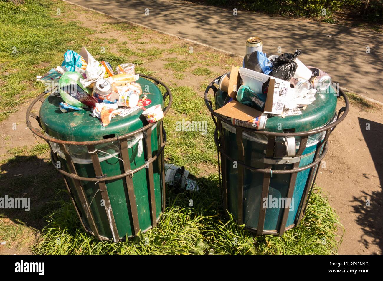 Overflowing waste bins on Barnes Common after the lifting of lockdown, London, SW13, U.K. Stock Photo