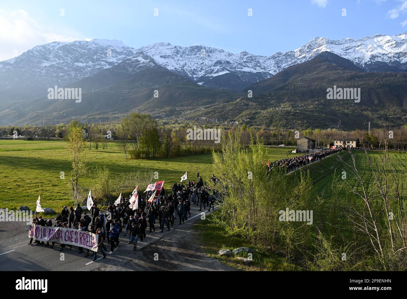 San Didero, Italy - 17 April, 2021: No-tav activists participate in a demo against the project of the new autoport in San Didero, Italy. During the march, the motorway Frejus Turin-Bardonecchia was also blocked, temporarily suspending traffic. Stock Photo