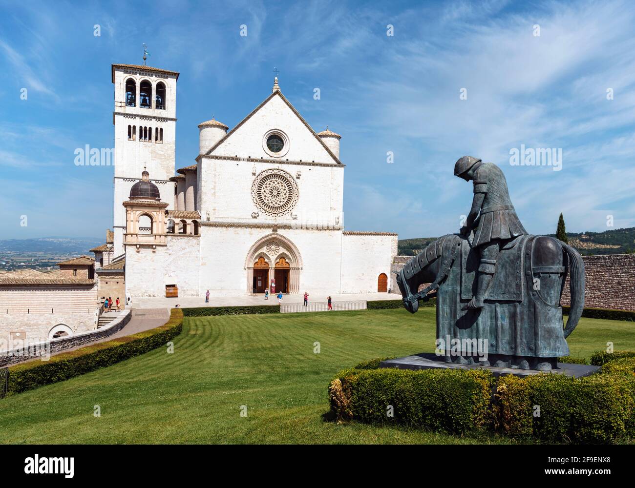 Assisi, Perugia Province, Umbria, Italy. Basilica di San Francesco.  Statue of The Return of San Francisco, by Norberto Proietti, 1927-2009. The statu Stock Photo