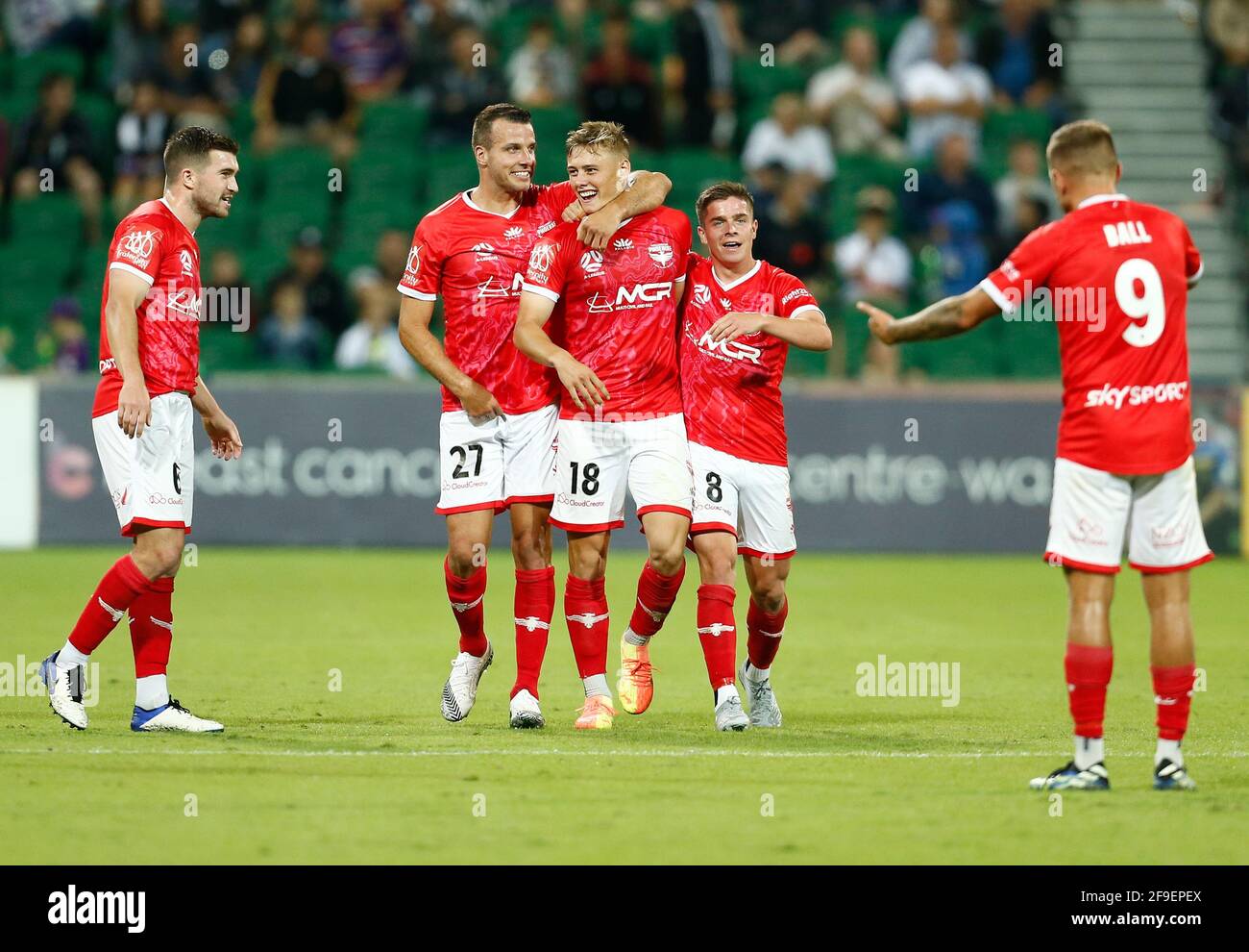 Perth, Western Australia. 18th April 2021; HBF Park, Perth, Western Australia, Australia; A League Football, Perth Glory versus Wellington Phoenix; Benjamin Waine of Wellington Phoenix celebrates his 56th minute goal with teamates after he put the Phoenix up 0-1 Credit: Action Plus Sports Images/Alamy Live News Stock Photo