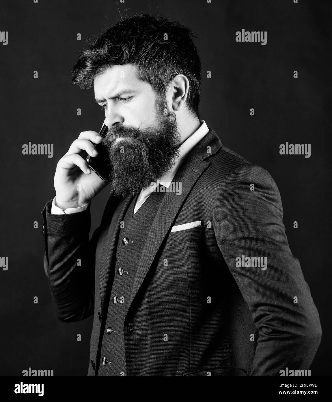 Guy call friend stand black background. Mobile call concept. Man formal