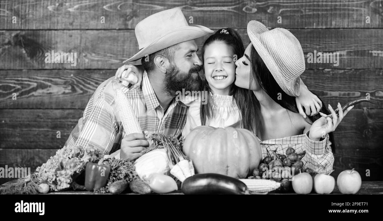 Parents and daughter harvest festival. Family farm concept. Family