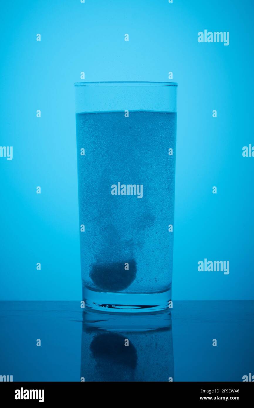 Effervescent tablet dissolves in a glass of water Stock Photo Alamy