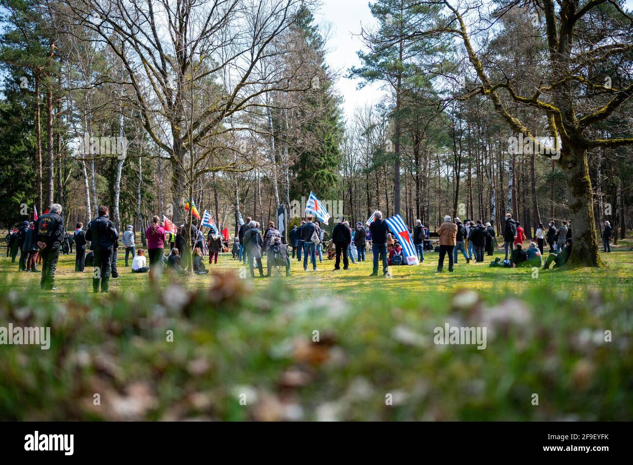 18 April 2021, Lower Saxony, Lohheide/Hörsten: People take part in a memorial service at the Soviet POW cemetery near Bergen-Belsen. The Association of Persecuted Nazis and the German Trade Union Confederation (DGB) commemorated the anniversary of the liberation of the Bergen-Belsen concentration camp. Photo: Philipp Schulze/dpa Stock Photo