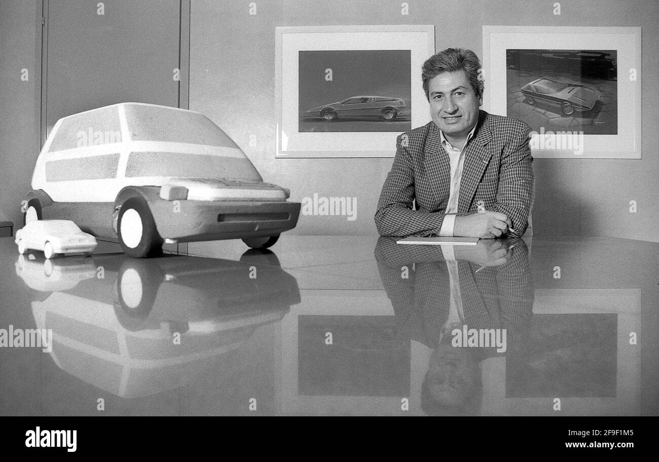 Italian Automobile designer Giorgetto Giugiaro head of Italdesign, shown with models of the Lancia Thena and Capsula.  Turin Italy 1986 Stock Photo