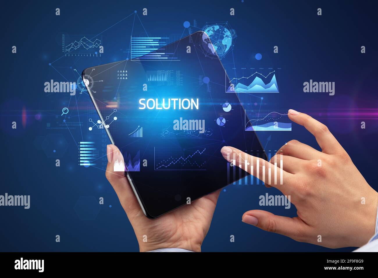 Businessman holding a foldable smartphone, business concept Stock Photo