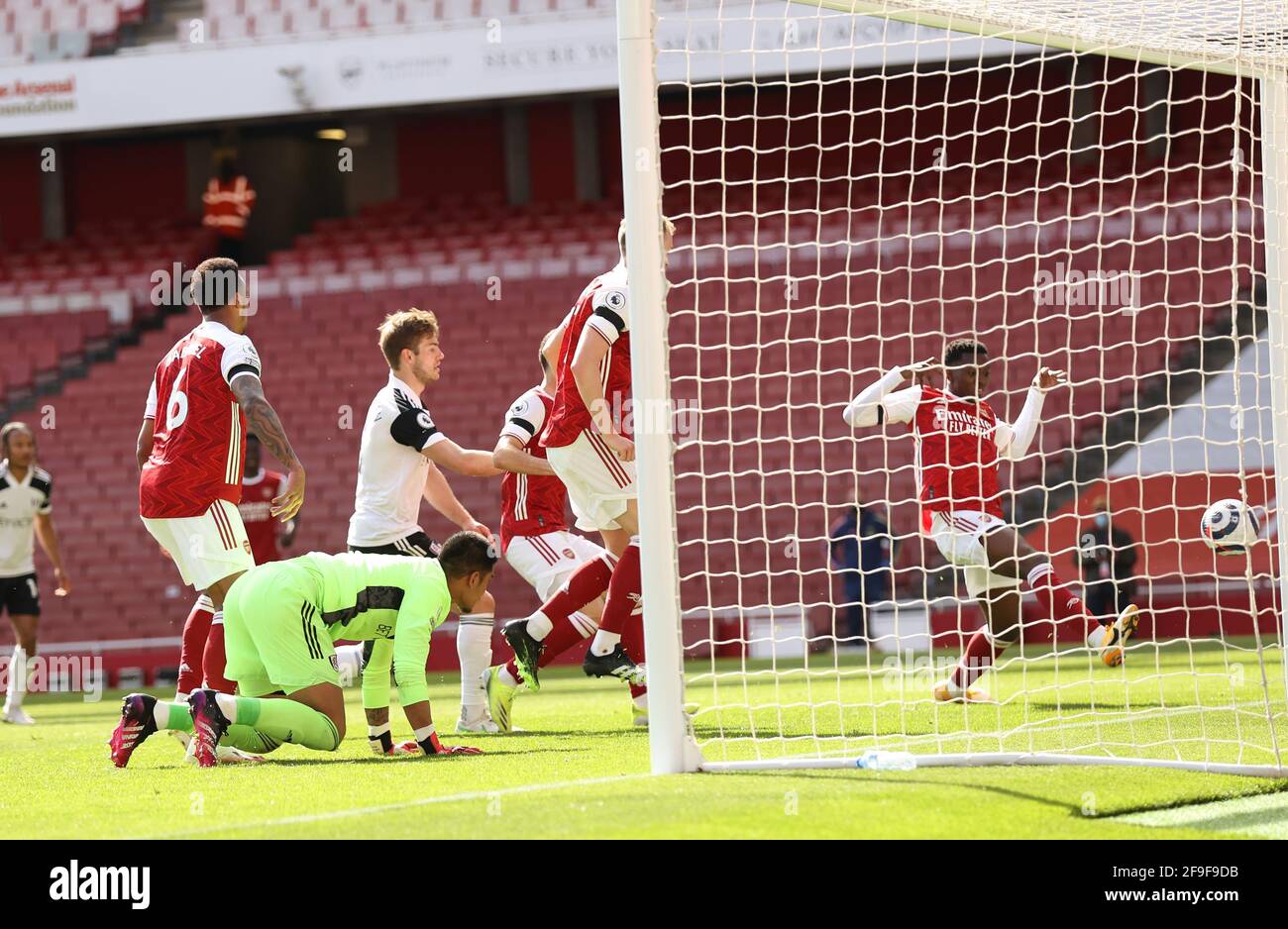 London, UK. 18th Apr, 2021. Eddie Nketiah of Arsenal (r) scores their equalising goal in extra time during the Premier League match at the Emirates Stadium, London. Picture credit should read: David Klein/Sportimage Credit: Sportimage/Alamy Live News Stock Photo