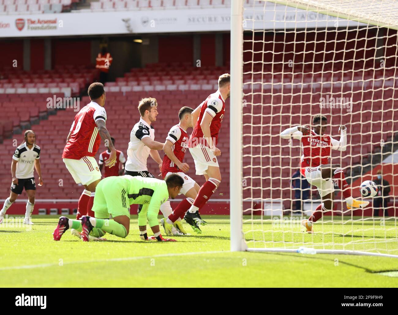 London, UK. 18th Apr, 2021. Eddie Nketiah of Arsenal (r) scores their equalising goal in extra time during the Premier League match at the Emirates Stadium, London. Picture credit should read: David Klein/Sportimage Credit: Sportimage/Alamy Live News Stock Photo