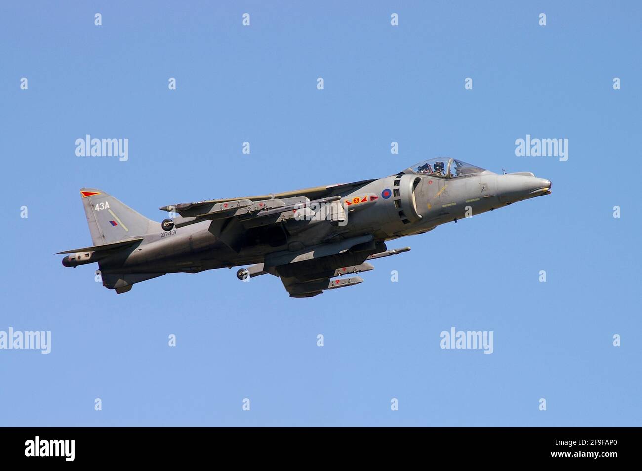 Fleet Air Arm BAe Harrier GR7 jump jet fighter plane hovering, flying at an airshow. In the