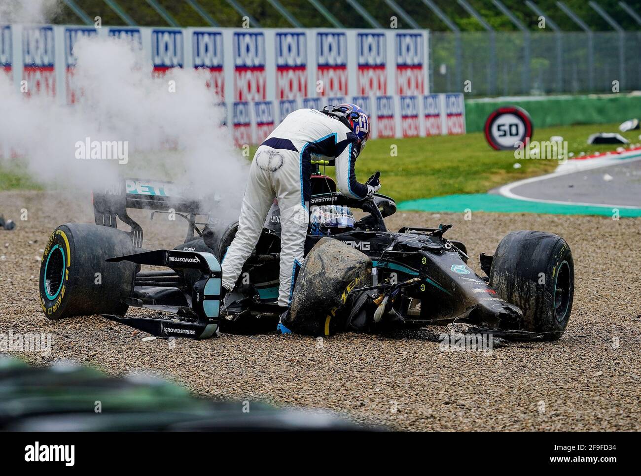 Imola Italy 18th Apr 2021 Motorsport Formula One World Championship Emilia Romagna Grand Prix Race Valtteri Bottas From Finland Of The Mercedes Amg Petronas F1 Team Stands By His Wrecked Race Car After An