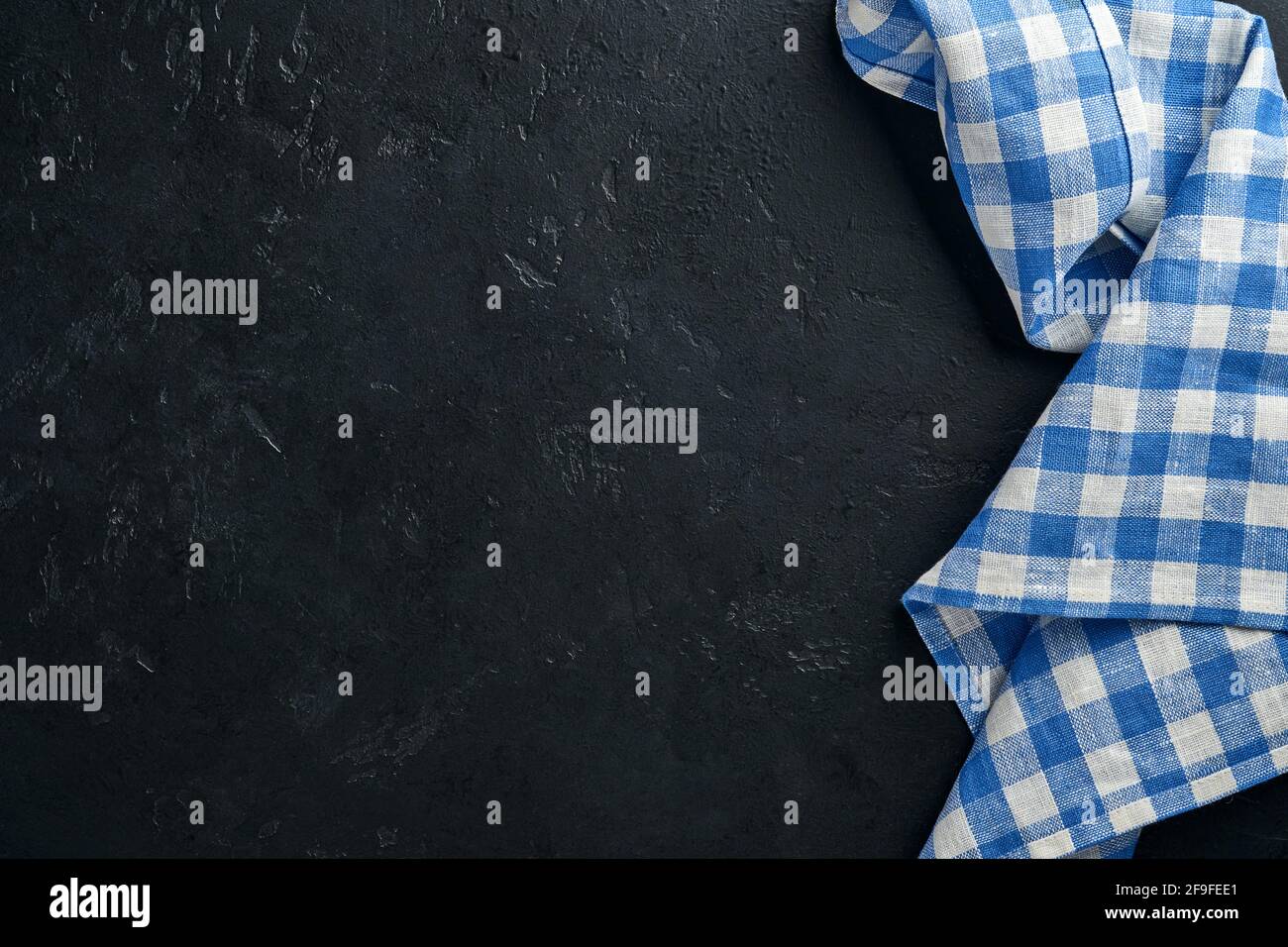 Blue tablecloth on kitchen table black color with for your recipe or menu. Top view flat lay. Mock up. Stock Photo