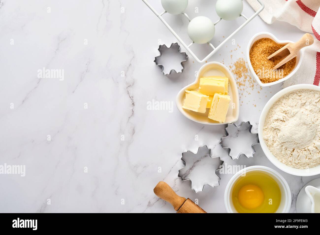 Baking background with flour, eggs, kitchen tools, utensils and cookie ...
