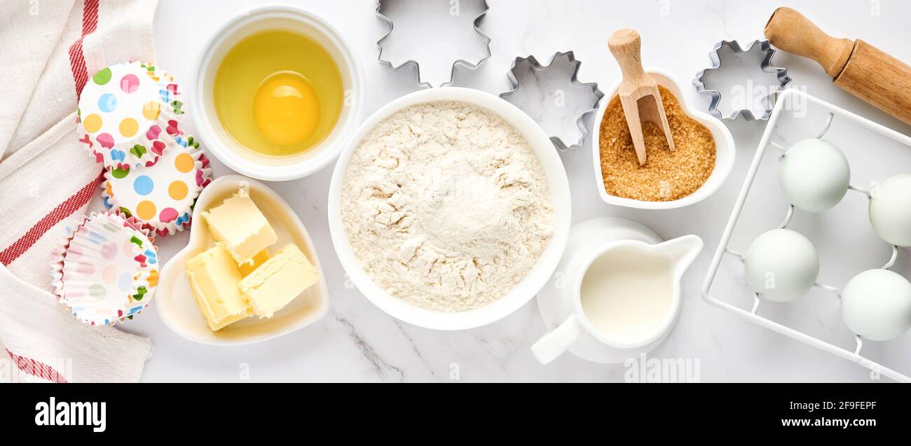 Baking background with flour, eggs, kitchen tools, utensils and cookie ...