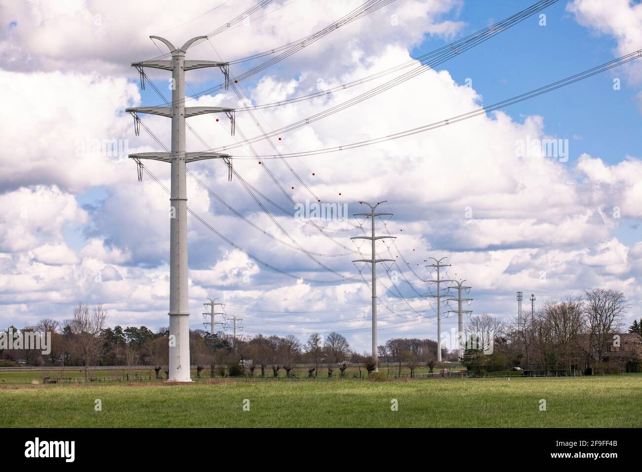 near Isselburg in Muensterland, 380 kV power lines run over solid wall pylons, it is a pilot project of the transmission system operator Amprion, Nort Stock Photo