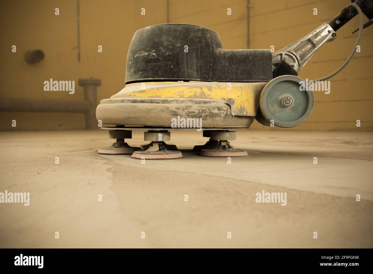 Concrete floor grinding. Construction process. Sanding a concrete floor